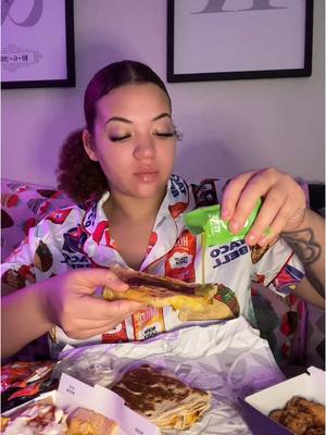 A post by @kayllalewis on TikTok caption: Taco Bell in my 🌮🔔 PJ’s !!  Crispy chicken cantina taco, crispy chicken nuggets + spicy ranch, stacker (add potatoes), & loaded beef nachos 