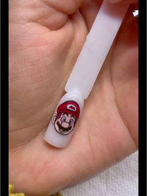 A post by @josselynalarconec on TikTok caption: #nailart #nailpaint #acrilicnails #mariobros #mariobrosnails 🥰