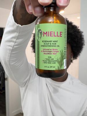 A post by @mielleorganics on TikTok caption: Be sure to oil your scalp! That's it. That's the caption. ✨