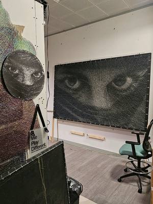 A post by @perspicere on TikTok caption: artwork made from 6000 lines of sewing thread #threadart #stringart #streetart 