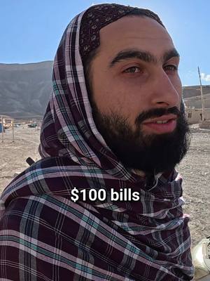 A post by @yourfellowarab on TikTok caption: Afghan Sees $100 Bill for First Time 🇦🇫