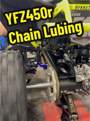 A post by @ononewheel7 on TikTok caption: Lubing my atv chain with the @oinker 520 chain oiler 😎 #yamaha #yfz450r #chain #maintenance 