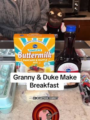 A post by @dukieduketwo on TikTok caption: Granny & Duke Make Breakfast 😂🔥😋 #howlilkidsbe #lilkidsbelike #cottonmouf #cottonmoufpuppets 