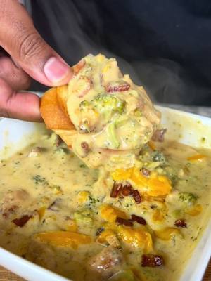 A post by @eatwitzo on TikTok caption: Chicken Bacon Broccoli Cheddar Soup 🥦🧀 Easily my favorite soup of all time! It’s been cold everywhere so let’s warm the house up 🔥  Full ingredient list:  1 lb chicken breast  1/2 lb bacon diced  2 cups chicken broth  1 cup half & half  1 cup heavy cream  3-4 cups chopped broccoli  1- 1 1/2 cups shredded carrots 1 cup diced onion 1 cup yellow cheddar cheese  1/4 cup flour 1 tbsp minced garlic or garlic paste  1 tsp garlic powder  1 tsp black pepper 1 tsp onion powder  1 tsp smoked paprika  1 tsp salt (optional)  1/2 tsp red pepper flakes (optional)  1/2-1 tsp chicken bouillon powder #broccolicheddarsoup #winter #eatwitzo 