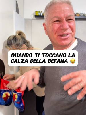 A post by @valeriovaramo on TikTok caption: Problemi con la Calza della Befana 😂 @Massimo Varamo @Angela Alviti #maaaèvalè #ridere #coppia #moglieemarito #mammaepapà #mamma #papá #mammaefiglio  