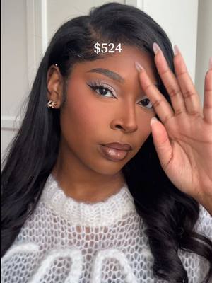 A post by @kamgregory on TikTok caption: okay i didn’t think it’d be THAT bad😭 can you guess how much my routine costs?   @Bobbi Brown face base @Kosas color corrector  @DanessaMyricksBeauty blurring balm powder @Haus Labs by Lady Gaga foundation  @NARS Cosmetics cream bronzer  @hudabeautyshop blush filter @Too Faced born this way concealer  @Hourglass Cosmetics concealer huda easy bake powder “ube birthday cake” + “peach pie” @makeupbymario master mattes palette @Clinique eyeliner  @Glossier lip liner @MAC Cosmetics USA lipstick “hodgepodge” #luxurymakeup #MakeupRoutine #makeuptutorial #beginnermakeup #makeuptips 