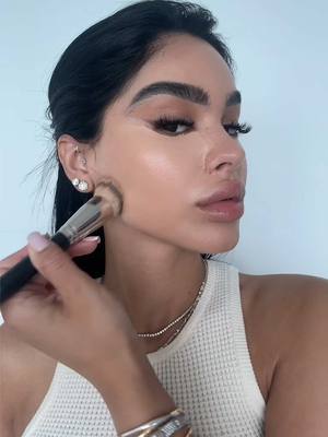 A post by @amayaliacolon on TikTok caption: Been loving this skin tint for my day time makeup 🤍  #fyp  @NARS Cosmetics concealer in ginger  @Haus Labs by Lady Gaga concealer shade 30 @Hourglass Cosmetics skin tint shade 10 & liquid blush in true rose @Milani Cosmetics spiced almond @Huda Beauty banana bread powder  @Fenty Beauty caramel cutie bronzer  & two’lip kiss gloss  @makeupbymario paradise pink blush @The Makeup Shack spill da tea liner  @makeupforever limitless brown liner  @maccosmetics c thru lipgloss 