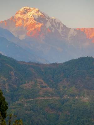 A post by @iiishaaa12 on TikTok caption: #ghandruk #sunset #fyp 