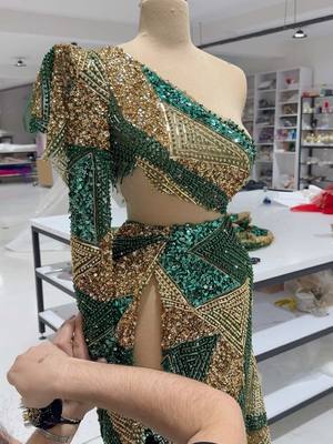 A post by @blini_official on TikTok caption: Gold and Green 🤨🧐 👌🏻 We got you... Enjoy the process of designing our unique design of these 2 color combinations combined with handmade fabric 🤩🔥 #blinifashionhouse #draping #drapingtechnique #fyp #foru #trendingvideo #trendingsong #workofart #viralvideos #fyp 