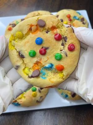 A post by @kay.gorg on TikTok caption: M&M Chocolate Chip Cookies  Ingredients  - butter golden box cake mix  - 2 eggs  - 1/2 cup vegetable oil or unsalted butter  - 1/2 cup chocolate chips  - 1/2 cup of M&Ms  To a bowl add your butter golden cake mix  Add two eggs  Add 1/2 cup of vegetable oil or unsalted butter  Mix until well combined  Add 1/2 cup chocolate chips  Add 1/2 cup of M&Ms  Mix well  Chill in fridge for 30 mins  Scoop 2 tablespoons out roll into balls  (Place on baking sheet spread out they big cookies)  Bake in oven for 13-15 mins  Enjoy  This batch created 10 big cookies!!!! 🍪  #fyp #trending #kaikyianna #cooknwkai #cooknwkaikyianna #cookie #baking #easy #delicious 