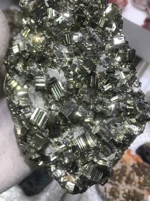 A post by @william_crystals on TikTok caption: Pyrite #gemstone #raw #specimen #minerals #shopping #amazing #energy #spark 