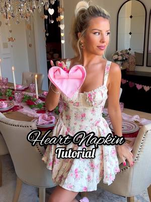 A post by @macy.blackwell on TikTok caption: Heart Napkin Tutorial!💖 Not gonna lie, this took me 5 times to finally get right. 😅 Sooooo cute, great for a Valentines/Galentines setup!!  #valentinesdaydecor #heartnapkin #vdaydecor #valentinesdecor 