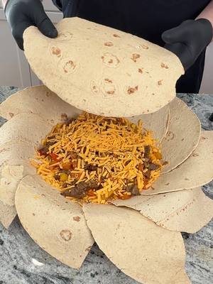 A post by @fooddudescook on TikTok caption: Mexican deep dish pizza #cheesepizza #EasyRecipe #cooking