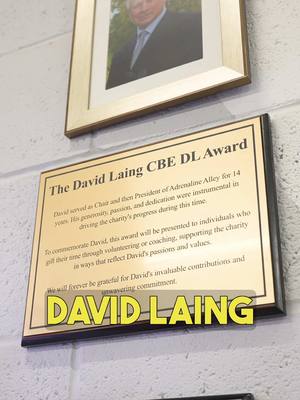 A post by @adrenalinealley on TikTok caption: On Tuesday 14th January, we proudly launched the David Laing CBE DL Award, a tribute to an extraordinary leader and supporter of Adrenaline Alley. The award was unveiled by our Chairman, André González De Savage, alongside David’s wife, Mary Laing, and his son, Ben Laing.💙 #adrenalinealley #corby #davidlaing #davidlaingcbedlaward