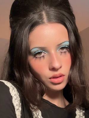 A post by @charlottelooks on TikTok caption: pretending i’m in the 60s for the premiere of a complete unknown 🩵  products  @Charlotte Tilbury flawless filter @Lancôme concealer @lorealparisuk le blush 120 and elnett hairspray @ColourPop Cosmetics cloud blue palette @MaybellineUK lash sensational waterproof @about-face beauty smoking room lip liner @YSL Beauty loveshine 200  @SearchlightUK #makeup #beauty #acompleteunknown 