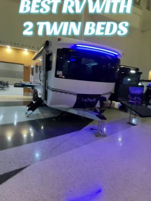 A post by @lakeshorervguy on TikTok caption: This is the coolest camper I have ever seen with 2 twin beds. This is the 2025 Aucta Willow #rv #camper #camping #glamping #travel #roadtrip #rvlife #van #vanlife 