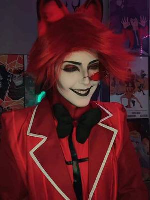 A post by @ on TikTok caption: #alastor #alastorhazbinhotel #hazbinhotelalastor #hazbinhotel #hazbinhotelcosplay #goth #angeldust 