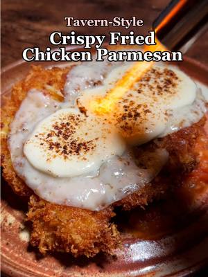 A post by @everhearth.inn on TikTok caption: Recipe here! Or on our site with decently better formatting 😅 also find us on other socials, check out our b10! Ingredients Chicken Parmesan - 2 cup Panko bread crumbs japanese style - 4 large eggs - ½ cup parmesean cheese freshly grated - 2 chicken breasts - 1-1.5 tsp garlic granules 1 1/2 if you are a garlic lover - vegetable oil for frying - 6 slices provolone the sandwich slices - 4 oz mozzerella - salt to taste - 1 box spaghetti prepared according to box instructions Tomato Sauce - 3 tbsp butter - 1 large yellow onion diced - 4-5 fresh basil leaves finely chopped - 4 garlic cloves chopped - 2 lbs tomato peeled and diced - 1 ½ tbsp honey or granulated sugar - salt to taste - pepper to taste Instructions Prepare the sauce - Melt the butter in a large saute pan over medium heat. Add in the chopped garlic, and cook until aromatic, about 1 minute. You can add extra garlic here if you are a garlic lover, I did 5 cloves.  - Add in the diced onion, and cook until transparent, about 7-8 minutes.  - Add the diced tomato, honey, salt and pepper to the pan  - Continue to cook until the sauce begins to boil, then turn the heat to low. Add in the basil and let simmer for 30 minutes, stirring occasionally to break up the tomato chunks. While the sauce is cooking, you can continue to the Chicken Parmesan preparation.  - Once the sauce is finished cooking, you can optionally use an immersion blender to puree the sauce. If you prefer a chunkier consistency, just leave it as-is.  Prepare the Chicken Parmesan - Preheat the oven to 350F (175C) - Cut the two chicken breasts in half, lengthwise. You will end up with a total of four thinner chicken breasts.  - Wrap each chicken breast half in plastic wrap, and tenderize until thin. Salt lightly and set aside.  - In a large bowl, whisk together the panko, parmesan, garlic granules, and additional salt. Don't add too much salt, since some has already been added to the chicken.  - In a medium mixing bowl, beat the eggs.   - Dip the chicken breast first in the eggs, then coat with the panko mixture. Dip again in the egg, and then coat again in the panko mixture. Set aside. (This second coating is optional, however I would highly suggest it as it made the chicken extra crispy and delicious!)  - In a large skillet, heat up 1/2 inch of the vegetable oil over medium heat. Add the chicken, and cook until golden brown, about 3 minutes per side. Transfer the fried breast to a prepared baking sheet.  - Top each of the chicken breasts with 1 1/2 slices of the provolone, and 1 oz of the mozzerella. Put them in the oven until the cheese is melted, about 3 minutes.  Plate the Dish! - To a plate, add the spaghetti (prepared according to box instructions), and then top with the tomato sauce.  - Finally, place the chicken on top of the sauce. Having the sauce under the chicken will ensure the chicken stays crispy!  - Feast and enjoy, adventurer!  #Recipe #chickenparm #chicken #cheese #EasyRecipe 