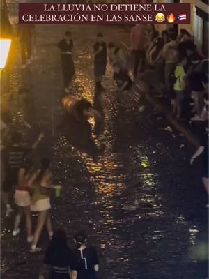 A post by @puertoricogram_ on TikTok caption: LA LLUVIA NO DETIENE LA CELEBRACIÓN EN LAS SANSE 😂🔥🇵🇷. “EEEHHHH JUAAAAAAAA” 😂 Video Credito: @Gus Juarbe De La Ros  #PuertoRico #PR #Sanse2025 #fiestasdelacallesansebastian  #Rain #DTMF