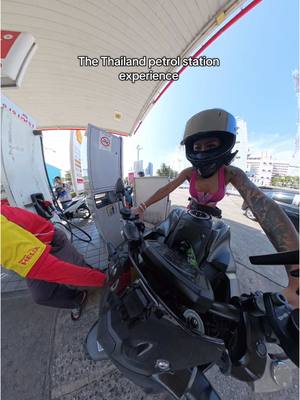 A post by @sukimarquez1 on TikTok caption: He made it look so easy 😂😂 #foryou #man #thailand #petrolstation #biker #girl #bikergirl #bikersoftiktok #motorcycle #bikelover #bikelife #tiktok #suki 