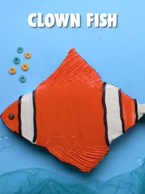 A post by @soyummy on TikTok caption: Transform a basic cake into a swimmingly sweet clownfish! 🐠🎂 #soyummy #cakeshaping #cake #cakedecorating #findingnemo #pixar #disneypixar #favoritemovies #kidsmovies #kidsbirthday #birthdaycake #creativecake #underthesea 