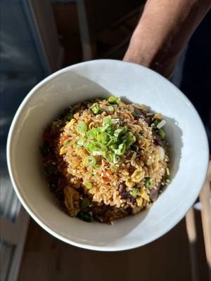 A post by @emmanuelduverneau on TikTok caption: We are back! Steak Fried Rice  Recipe: Steak marinade: 13 oz beef chuck 1 tsp soy sauce 4 tsp oyster sauce 4 Tbsp water 2 garlic cloves, grated 1/2 tsp sugar  1/4 tsp baking soda  2 Tbsp avocado oil -In a large bowl, mix together all marinade ingredients, except for avocado oil. Add beef, fully coating all sides. Let marinate for at least 1 hour.  -Add avocado oil to a wok and cook beef until cooked through and lightly charred. Remove and set aside. Fried rice: 4 Tbsp butter, divided  1 carrot, diced 1/2 onion, diced  3 garlic cloves, finely chopped  4 cups jasmine rice, cooked 1 Tbsp avocado oil 4 eggs, whisked and seasoned with salt and pepper 3 Tbsp soy sauce  1/2 tsp salt  1/2 tsp white pepper  2 Tbsp sesame seeds  4 scallions chopped, plus more for topping -In the same wok, add 2 Tbsp butter and let melt. Add garlic, onions, carrots, and green peas. Cook until onions are softened and translucent.  -Add rice and mix. Cook for 1 minute and push the rice to the side. Add 1 Tbsp of avocado oil and eggs. Scramble eggs and cook almost all the way. Mix with the rice.  -Add soy sauce, salt, white pepper, and sesame seeds. Mix to combine.  -Add the beef back and mix. Add another 2 Tbsp of softened butter, let melt, mix, and cook for 2 minutes. Mix in scallions and cook for another minute. Top with more chopped scallions and enjoy! #food #EasyRecipe #friedrice #steak 