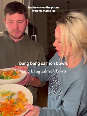 A post by @ariel_hendrixx on TikTok caption: BANG BANG SALMON BOWLS⬇️ (save it for later or save it on ig) bang bang sauce: 1 cup mayo 1 tsp chili garlic sauce  2 tablespoons thai sweet chili sauce 2 tsp sriracha (to taste, eliminate if you don’t like spice) salmon: 2 pounds fresh salmon 1/3 cup soy sauce salt and pepper 4 cups white rice 4 cups water head of broccoli 1 cup julienne carrots 1 avocado fresh cilantro chopped cook the rice in a rice cooker for perfect sticky rice. Peel the skin off the salmon before chopping into one inch pieces. Add to a bowl and coat with salt, pepper, and soy sauce. In a large cast iron skillet, coat with olive oil and bring to medium heat. add salmon and cook 2-3 minutes each side, turning gently so they don’t break apart.  chop broccoli into small clusters. steam in a steamer or in a sauce pan with a lid. add a drizzle of olive oil, salt, and 3/4 cup of water. cook on medium heat for about 10 minutes, not opening the lid and until soft. make your bowls starting with rice, salmon, broccoli, carrots, avocado and the bang bang sauce. Garnish with sesame seeds. #EasyRecipe #sushibowl #salmonrecipe #salmonbowl @Amazon Influencer Program @Kraft Sauces @Lodge Cast Iron @Caraway Home @KitchenAid 