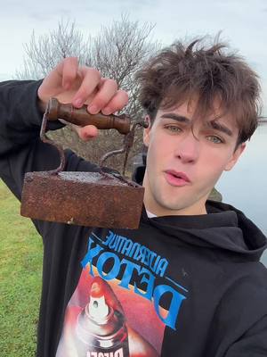 A post by @kylethomas on TikTok caption: WE FOUND 2 THINGS 🧲🎣 magnet fishing is exhausting 🤣