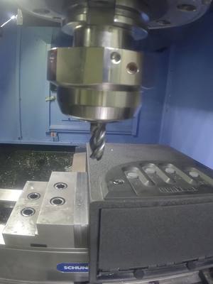 A post by @titansofcnc on TikTok caption: CNC Machine Opens Locked Safe #titansofcnc #titansofcncacademy #cnc #cncmachining #cncmachinist #machining #manufacturing #machinery #3dprinting #engineering #automation #aerospace #cncmill #cnclathe #cncprogramming #cncprogrammer #aerospace #machineshop #cncmachinetool #edm #additive #grinding #grindingmachine #swiss #swissmachine #swissmachining #swisslathe #Kennametal