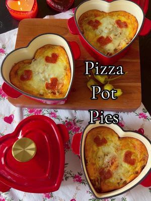 A post by @macy.blackwell on TikTok caption: Pizza Pot Pies!🍕♥️ A fun and festive dinner! You can use any size/shape of bakers, and customize toppings!  Ingredients:  Biscuit dough  Butter + Italian seasoning  Pizza sauce  Mozzarella cheese  Optional: pizza toppings Directions:  1. Press 1 biscuit dough into the bottom of each sprayed baking dish. (Depending on the size of dish you could use more or less dough)  2. Brush with butter + Italian seasoning  3. Add a layer of pizza sauce  4. Lots of cheese!  5. Any additional toppings!  6. Bake about 20-25 minutes on 350  #EasyRecipes #weeknightdinner #familydinner 