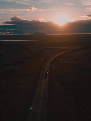 A post by @lotterlive on TikTok caption: Missing these sunset drives🖤  #traveltiktok #reiseblogger #tiktoktravel #reisen #dronevideo #iceland #icelandtravel 