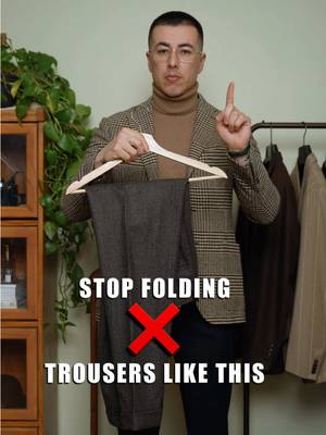 A post by @blakescott_ on TikTok caption: How to properly fold and hang your trousers.  #styletips #trousers #foldingclothes #foldinghacks