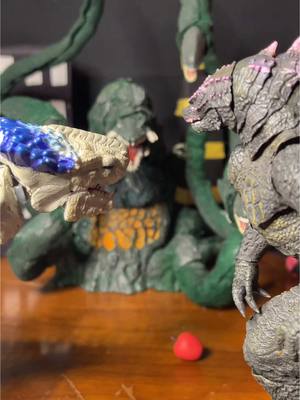 A post by @jason1132045 on TikTok caption: Godzilla and Shimo the hole #Godzilla#godzillaactionfigures#comedy#thehole#shimo#biollante#shingodzilla#actionfigures 