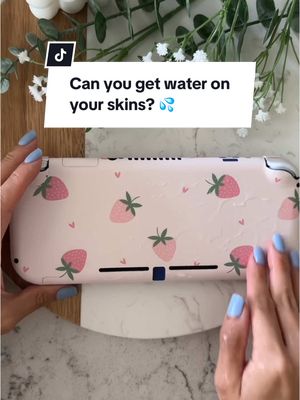 A post by @stickietech on TikTok caption: Replying to @jiyaeseyon Skins are water resistant. Do not submerge in 💦 #switchskin #switchlite #switchaccessories #gamingaccessories #vinyldecals #cozygamer #stickietech 