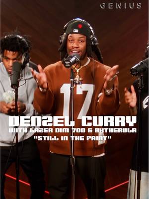 A post by @genius on TikTok caption: 😮‍💨 don't hurt em @DENZEL CURRY 🎤🔥🎶 #genius #openmic #stillinthepaint #denzelcurry #lazerdim700 #bktherula #hiphop #rap #viralmusic #musictok #hardindapaint #wakaflockaflame