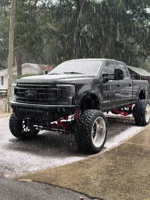 A post by @landon_.burdick on TikTok caption: Snowing in Florida? #snow #florida #onthisday #viral #lifted #trucks #f250 #truck #foryou #alumiduty 