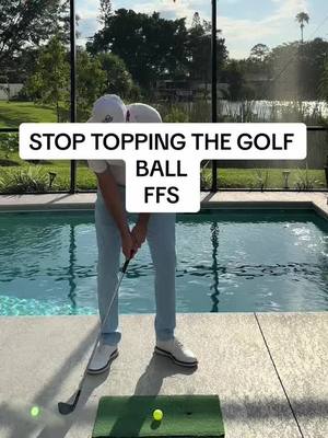 A post by @golfpantsman on TikTok caption: Stop topping the ball! #golftipsforbeginners #golftip 