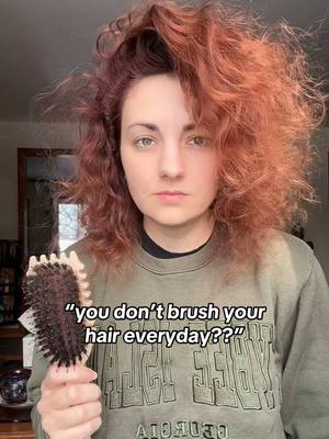 A post by @meganciafre on TikTok caption: This is why you don’t brush dry curls lol