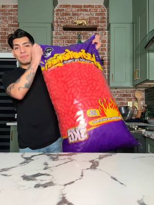 A post by @daveyrz on TikTok caption: Is this the worlds biggest bag of hot Cheeto puffs? 