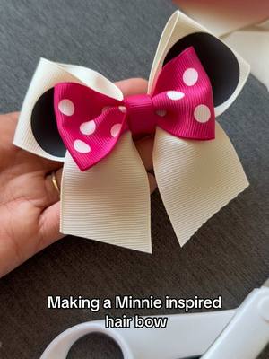 A post by @monicacraftsitall on TikTok caption: You’ll need a white 1 1/2 inch ribbon 16 inches long, a pink dotted 1 1/2  inch ribbon 6 inches long and two htv vinyl black circles for this hair bow. Minnie inspired hair bow tutorial #hairbowtutorial #hairbowdiy #bowdiy #ribbon #moño #liston 