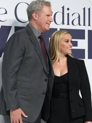 A post by @enews on TikTok caption: You’re cordially invited to see Will Farrell and Reese Witherspoon walk the white carpet. 😉