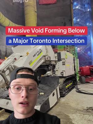 A post by @blogto on TikTok caption: A huge void is forming below King and Bathurst #toronto #ontario #ontarioline #transit #construction #fyp #greenscreen 