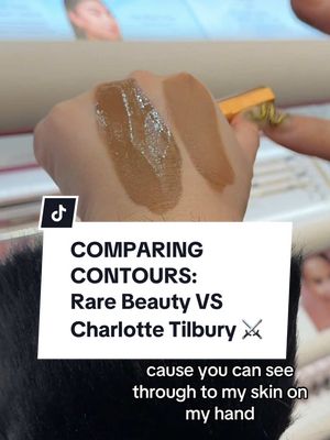 A post by @thelipsticklesbians on TikTok caption: Replying to @illumin555 When I swatched @Rare Beauty’s new contours in @sephora, I couldn’t help but think of @Charlotte Tilbury’s contour wands—so naturally I had to do a little in store comparison to get a feel for their textural differences. Rare’s was definitely more sheer and had more radiance while Charlotte’s had a more pigmented to matte finish. It’s always interesting to see products next to each other like this, especially to see how differently they dry down and spread! which one would you reach for? #BeautyTok #makeupreview #rarebeauty #charlottetilbury #mua 