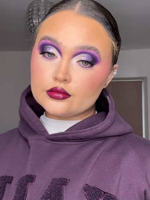 A post by @itsrubysmakeup on TikTok caption: Monochromatic makeup💜 - @byelliebeauty brow texture  - @By Caitlyn Collection brow pencil and Amelia lashes  - @PLOUISE eye base in 2.0 and blank canvas paint  - @BPerfect Cosmetics bronze boost , XL carnival , love Tahiti and chroma cover foundation shade N3 - @withlovecosmetics pressed glitters , and sugar plum blush duo - @Jordana Ticia Cosmetics bronzer duo in palm paradise and powder duo in half baked and pearl sugar also twinkle tower on cheeks  - @Fyne Cosmetics concealer shade 12 - @maccosmetics lip pencils in mahogany and beet  - @Fenty Beauty fuschia flex gloss bomb - @Peaches & Cream brushes  - @Doll Beauty brushes and setting spray 