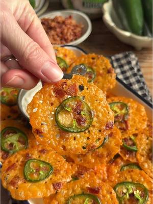 A post by @crowdedkitchen on TikTok caption: Jalapeño Popper Cheese Crisps + Marie’s Ranch for dipping = the ultimate 4-ingredient Super Bowl snack! #MariesPartner  Save the full RECIPE below👇 These couldn’t be easier to make and they’re bound to be the biggest hit at your Super Bowl party!! Crispy, cheesy, spicy, and dipped in Marie’s creamy ranch dressing, which is absolutely delicious 😍 You can find it in the refrigerated produce section of your local store!  Tip: buy cheddar in a block and shred it yourself – it will melt much better and crisp up faster/more evenly! Jalapeño Popper Cheese Crisps (makes ~32)  6 slices cooked bacon, chopped finely  8 oz sharp cheddar cheese  1 large or 2 small jalapeños, sliced thinly  Marie’s Creamy Ranch Dressing for dipping  Preheat oven to 375˚F.  Finely shred the cheddar cheese.  Using a heaping 1/2 tablespoon of shredded cheddar per crisp, place cheddar down on a nonstick sheet pan in little piles, leaving space in between (they will spread).  Top with crumbled bacon, then place a jalapeño slice on top.  Bake for 10-12 minutes, until the cheddar is a deep golden brown. Keep an eye on your oven – it may take more or less time depending on exactly how much cheese you used.  Let cool on the sheet pan until set, then remove with a spatula. Enjoy dipped in Marie’s Ranch! 