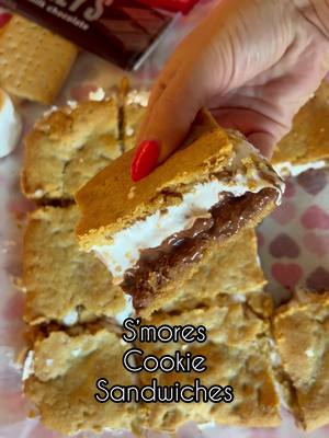 A post by @macy.blackwell on TikTok caption: S’mores Cookie Bars!🍫🍪🔥 This is the best dessert I’ve tried in a long time!! Came out perfectly!! Used the recipe from @lifestyleofafoodie Ingredients  * ½ cup Butter softened (salted or unsalted) * ⅓ cup brown sugar * ¼ cup sugar * 1 egg * 1 teaspoon vanilla  * 1 1/2 cup flour * ½ cup graham crackers finely crushed, (for the cookie dough) * ¼ teaspoon salt * ¾ teaspoon baking soda * 5 standard Hershey bars * 1 ½ cup Marshmallow fluff Directions:  1. Preheat the oven to 350F then line an 8x8 inch baking pan with parchment paper and set it aside.   2. Cream the butter, sugar, and brown sugar. Add in the egg and the vanilla and mix again.   3. Add in the flour, graham cracker crumbs, salt, baking soda, and mix.   4. Press half of the dough evenly onto the prepared baking sheet then remove that parchment from the pan and place in the fridge while you re-line the pan with more parchment paper and repeat the process with the leftover cookie dough.   5. Place the chocolate bars over the dough. Spread the marshmallow fluff on top of the chocolate bar then gently flip the chilled cookie dough layer on top.   6. Bake the cookies in the preheated oven for 25 minutes. Make sure you let the bars cool down fully before slicing.   #smores #EasyRecipes #easydessert 