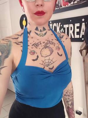 A post by @misspumpkin13 on TikTok caption: sunday 💙💙💙💙💙  #pinuphair #pinup #orangehair #inked #rockabillygirl #foryoupage❤️❤️ #rockabillystyle #pourtoi 