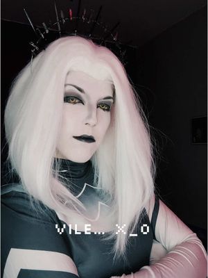 A post by @ on TikTok caption: Vile.. #lute #lutehazbinhotel #hazbinhotellute #hazbinhotelcosplay #hazbinhoteladam #adamhazbinhotel #lutehazbinhotelcosplay #hazbinhotel #hazbinhotelvaggie 