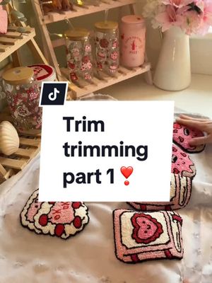 A post by @themustudiosco on TikTok caption: First trim for the valentines mug rugs!🎀🧸 #punchneedlemugrug #mugrug #punchneedlecoaster #punchneedle  #punchneedletiktok #trimtrim #trimming 