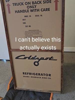 A post by @dustyoldstuff on TikTok caption: Even i haven't seen anything like this before! Original 1950s refrigerator unopened in its shipping crate. #vintage #antique #refrigerator #1950s